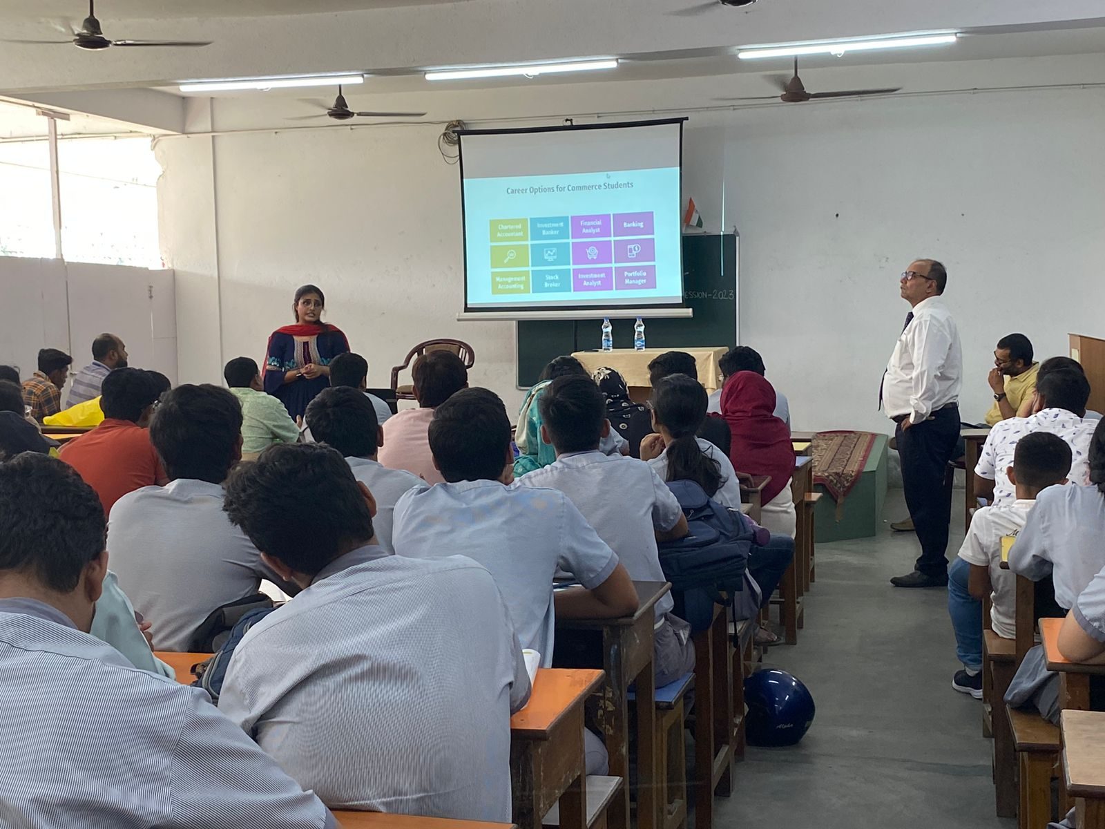 Classroom session with a slide titled Career Options for Commerce Students