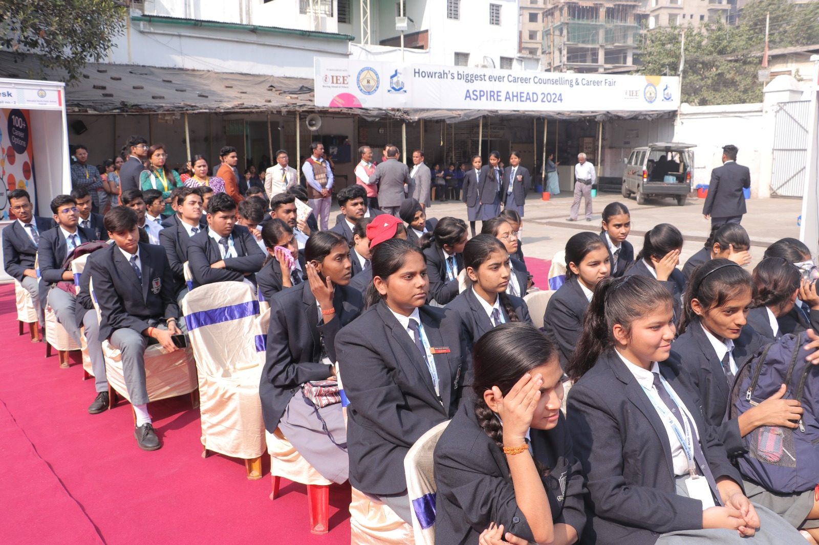 School students seated outdoors at the Aspire Ahead 2024 career counselling and career fair